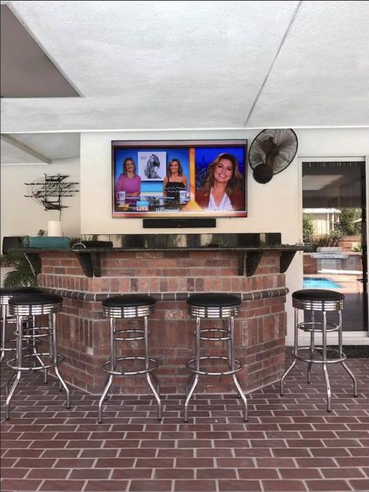 Outdoor TV installed by Kalieb Designs at a Bakersfield pool bar